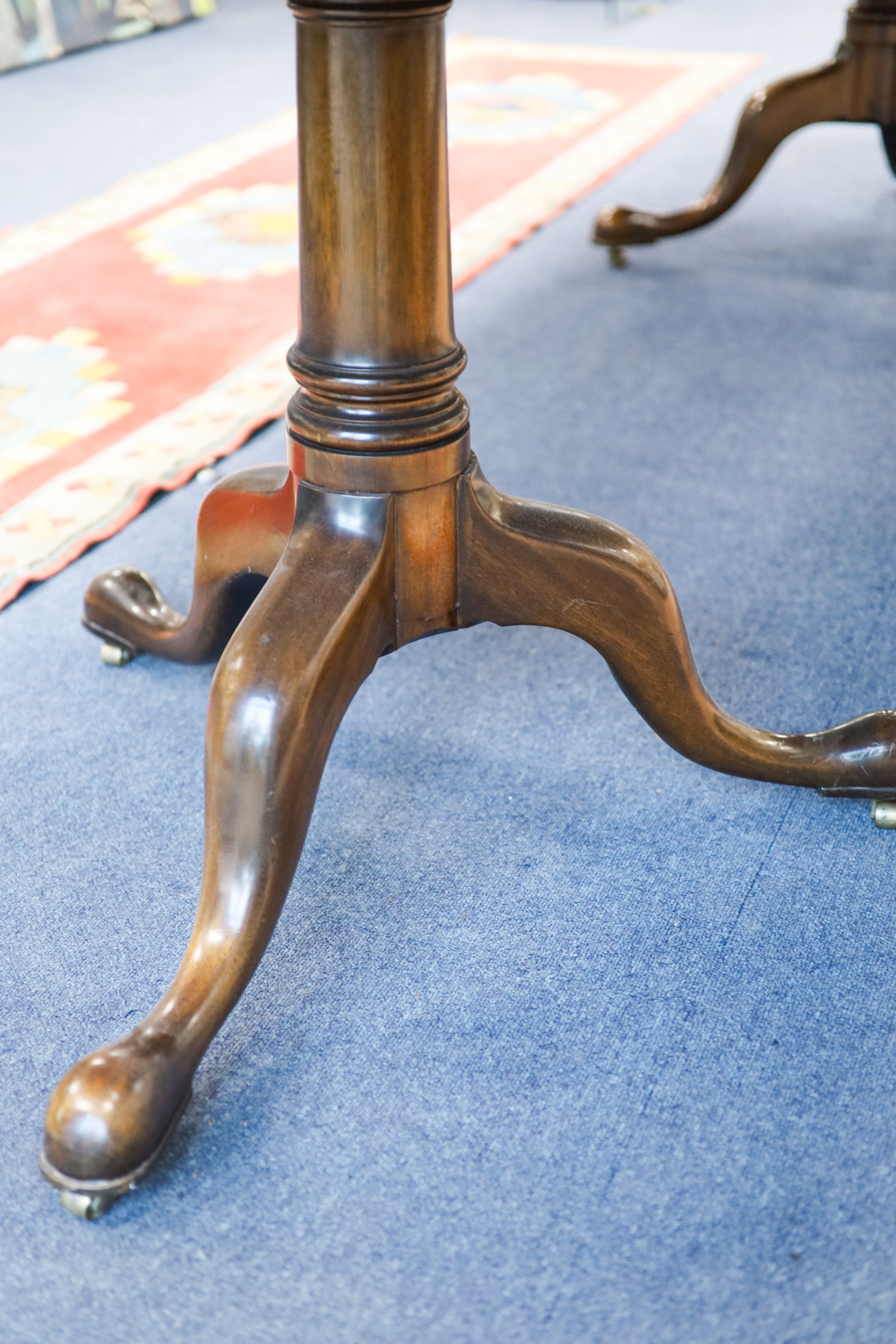 A George III style mahogany two pillar extending dining table, length 276cm extended, two spare leaves, width 114cm, height 72cm